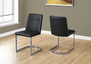 Two 34" Black Leather Look and Foam Dining Chairs with Chrome Legs