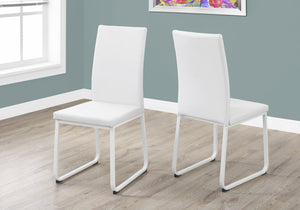 Two 38" White Leather Look, Foam, and Metal Dining Chairs